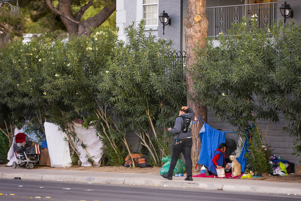 People make temporary homes amongst the trees off E. Twain Ave. near Molasky Family Park on Mon ...