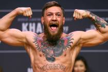 Conor McGregor weighs in ahead of his fight against Khabib Nurmagomedov during the ceremonial w ...