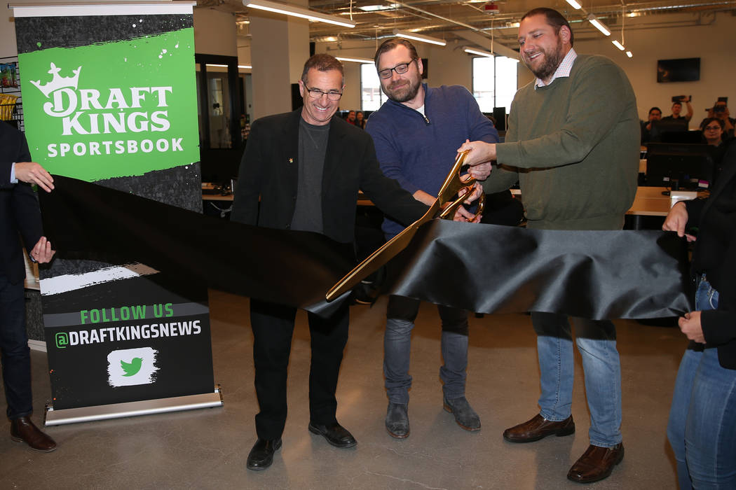 DraftKings' Johnny Avello, from left, director of race and sports books operations, Matt Kalish ...