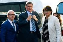 FILE - In this Dec. 1, 2017, file photo, Michael Flynn, center, arrives at federal court in Was ...