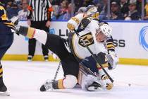 Buffalo Sabres goalie Linus Ullmark (35) brings down Vegas Golden Knights forward Cody Eakin (2 ...