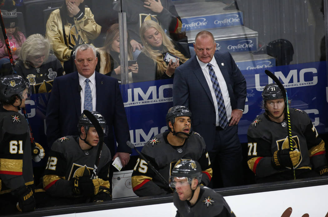 Vegas Golden Knights head coach Gerard Gallant, right, and assistant coach Mike Kelly, left, ar ...
