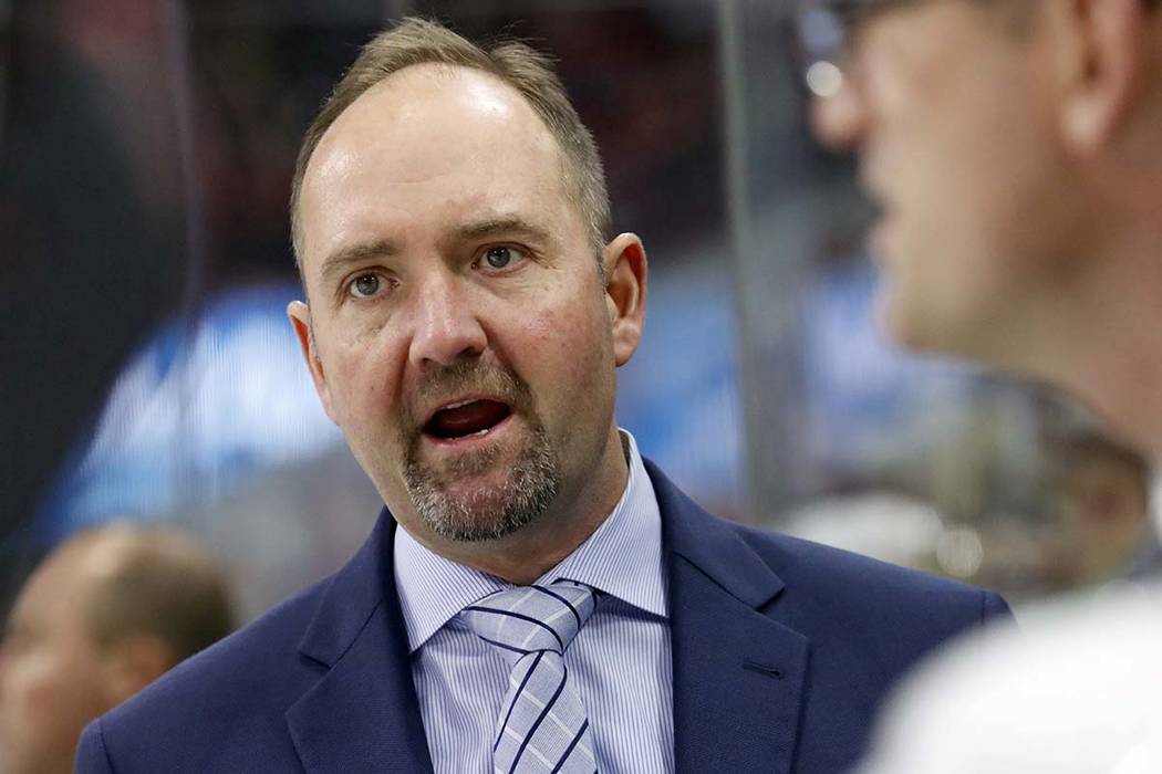 Then-San Jose Sharks' head coach Peter DeBoer directs the team during the second period of an N ...