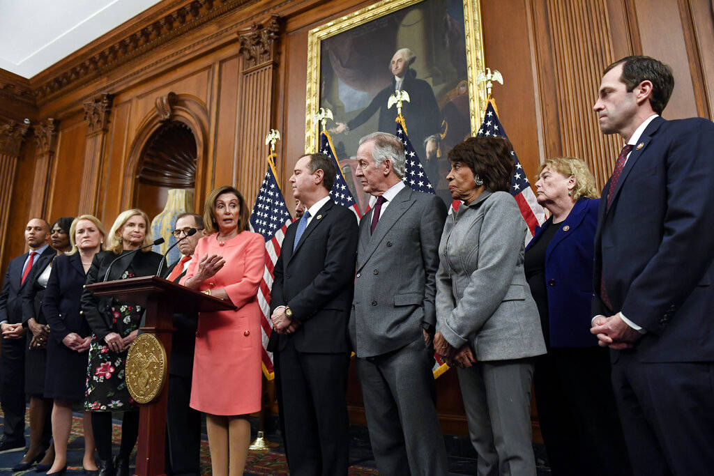 Speaker of the House Nancy Pelosi, D-Calif., speaks during an engrossment ceremony to sign the ...