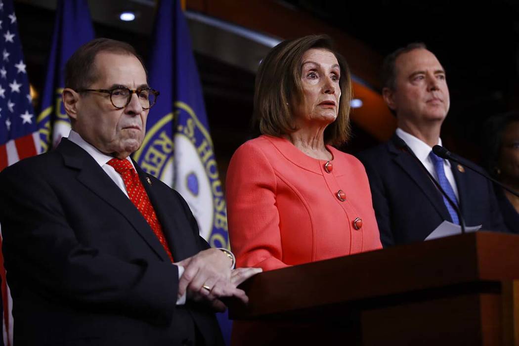 House Speaker Nancy Pelosi of Calif., speaks during a news conference to announce impeachment m ...