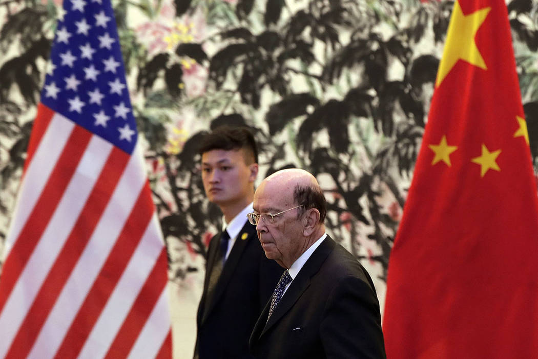 U.S. Commerce Secretary Wilbur Ross arrives to the Diaoyutai State Guesthouse to attend a meeti ...