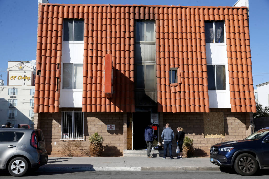 Investigators gather evidence at the Alpine Motel Apartments in Las Vegas on Tuesday, Jan. 14, ...