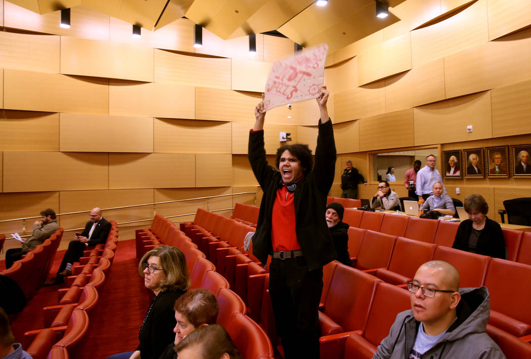 Jonas Rand of Las Vegas chants at the start of a Las Vegas City Council meeting Wednesday, Jan. ...