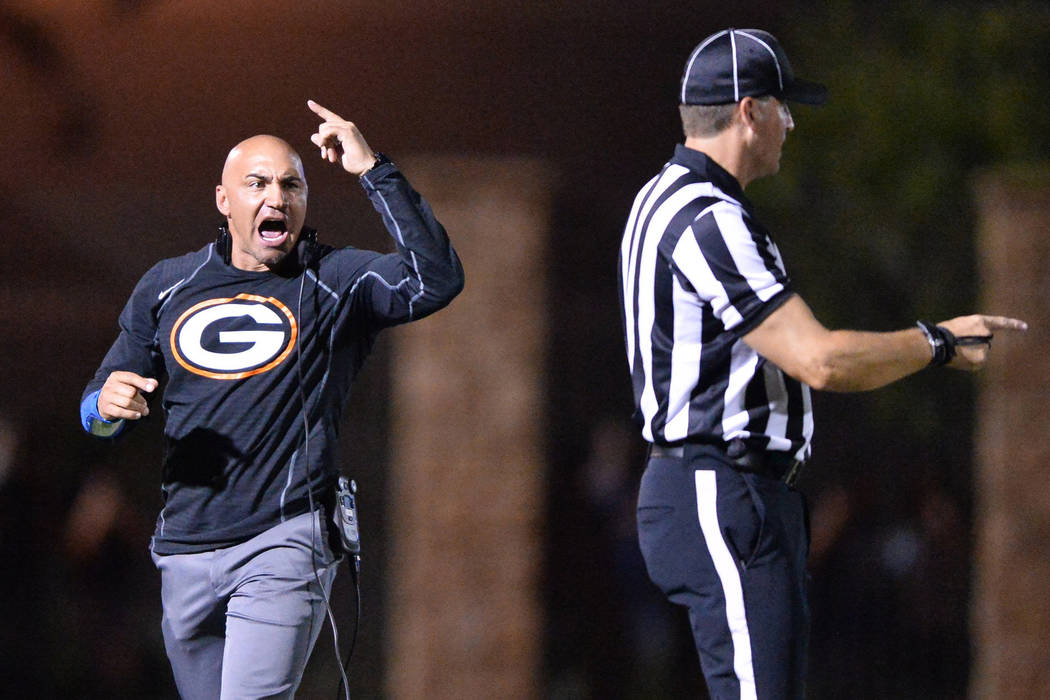 Bishop Gorman head coach Kenny Sanchez argues a call during the Bishop Gorman High School Kahuk ...