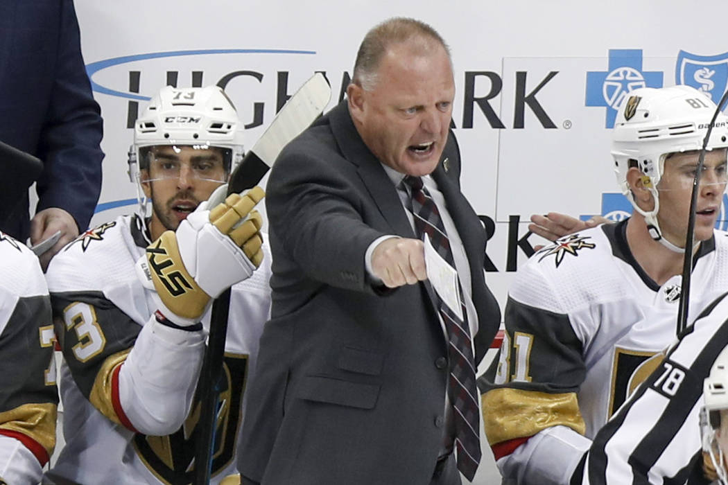Vegas Golden Knights' Gerard Gallant, center, yells towards an official during the third period ...