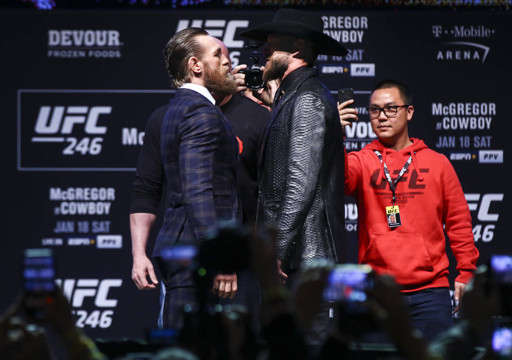 Conor McGregor, left, and Donald ÒCowboyÓ Cerrone pose for pictures during a press co ...