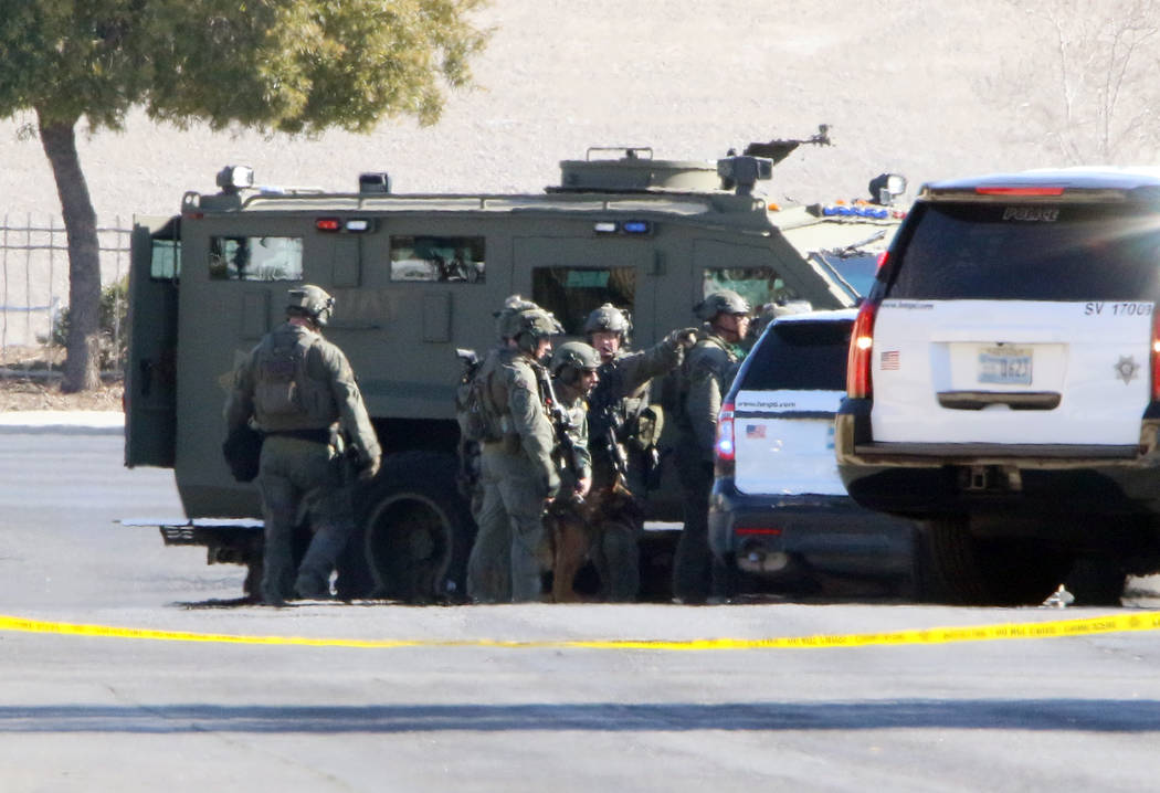 SWAT officers near Rainbow Boulevard and Darby after an officer-involved shooting in the 6900 b ...
