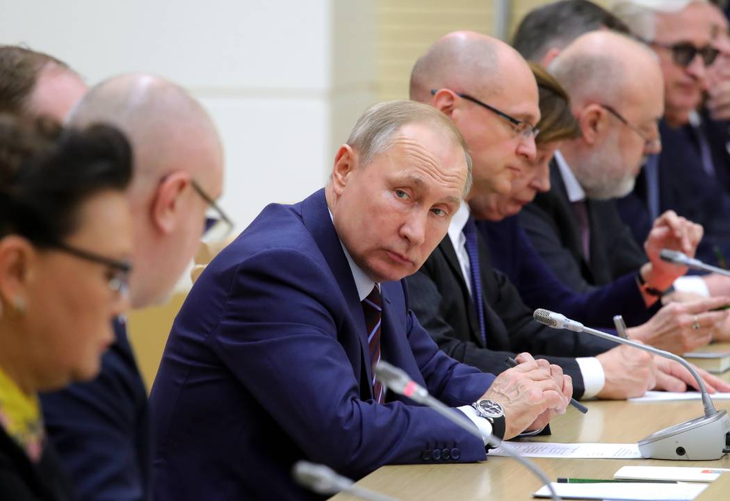 Russian President Vladimir Putin attends a meeting on drafting constitutional changes at the No ...