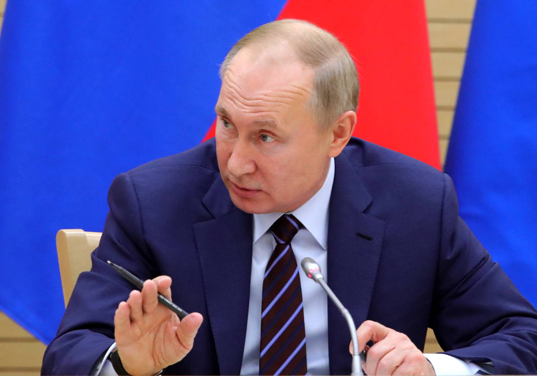 Russian President Vladimir Putin speaks as he chairs a meeting on drafting constitutional chang ...