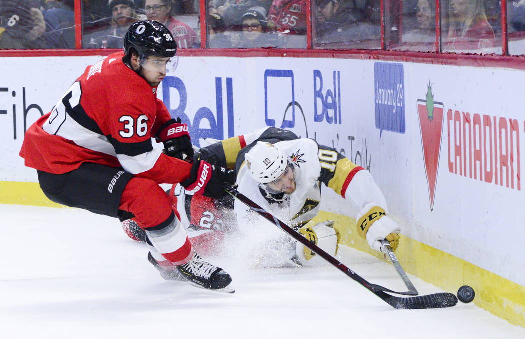 Vegas Golden Knights Nicolas Roy (10) fights for the puck against Ottawa Senators Colin White ( ...