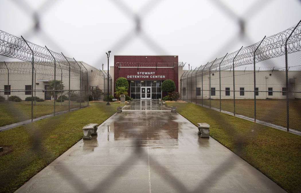 The Stewart Detention Center is seen through the front gate, Friday, Nov. 15, 2019, in Lumpkin, ...