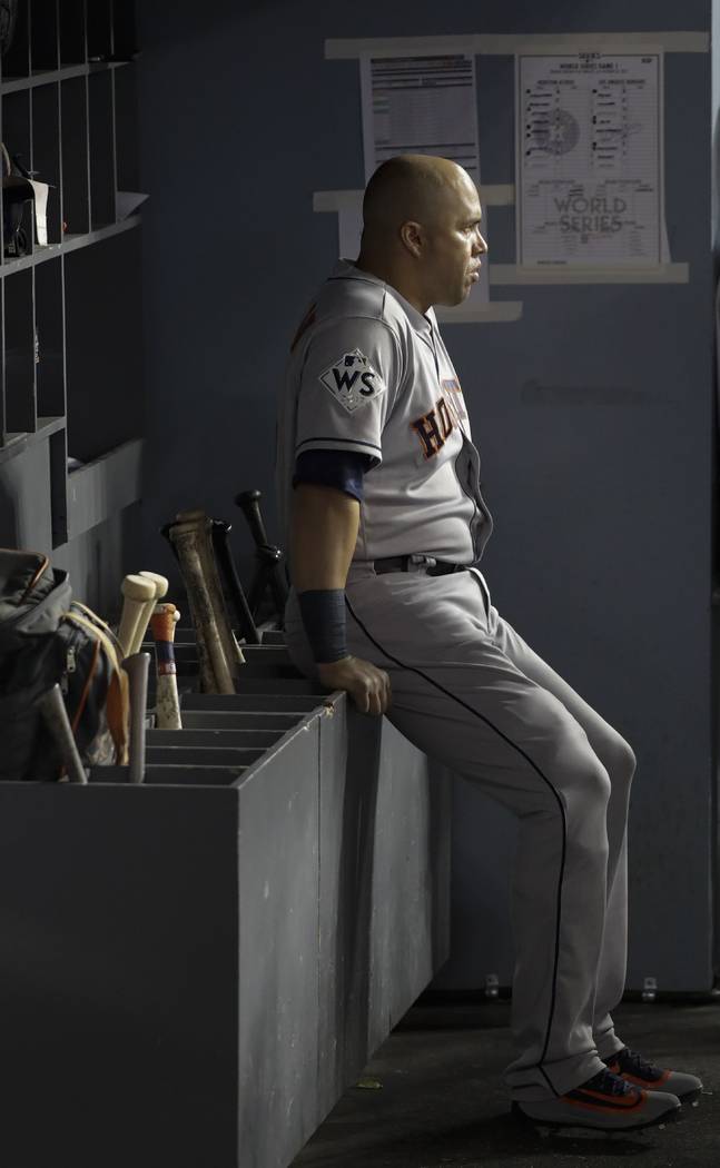FILE - In this Oct. 24, 2017, file photo, then-Houston Astros' Carlos Beltran waits in the dugo ...