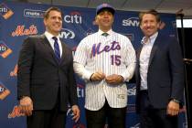 New York Mets manager, Carlos Beltran, center, poses for a picture with general manager Brodie ...