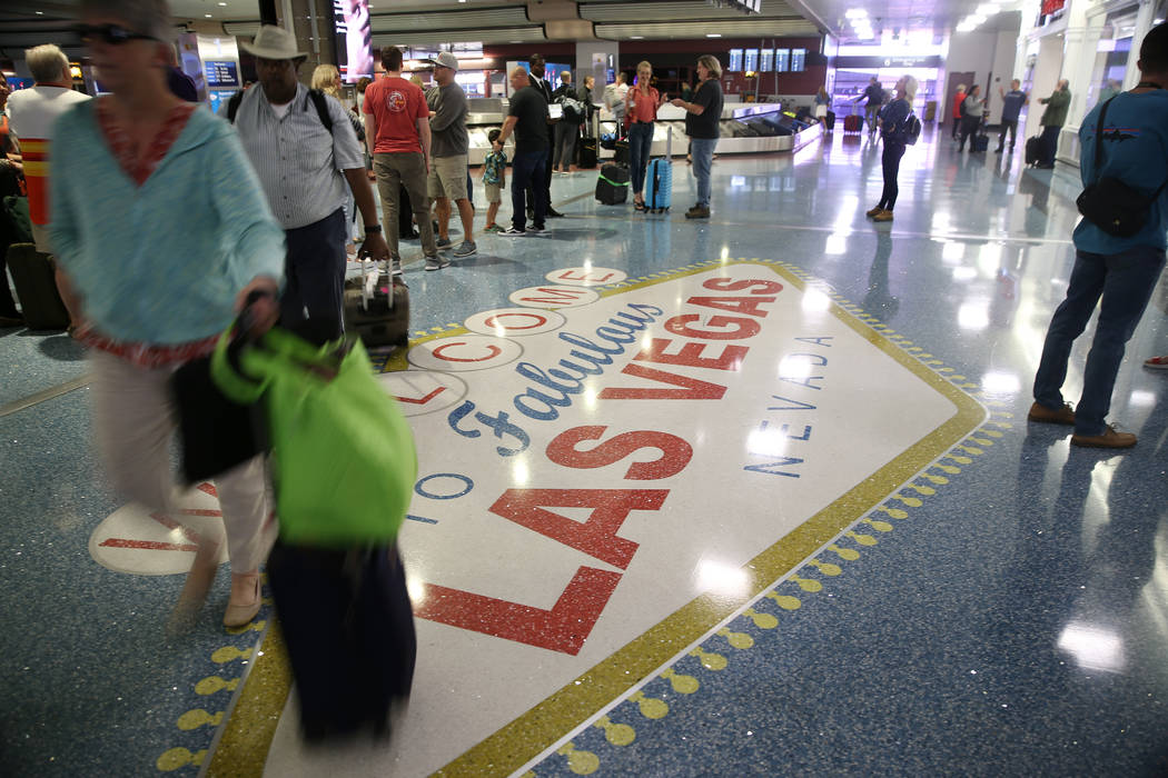Passengers at baggage claim in Terminal 1 at McCarran International Airport in Las Vegas, Oct. ...