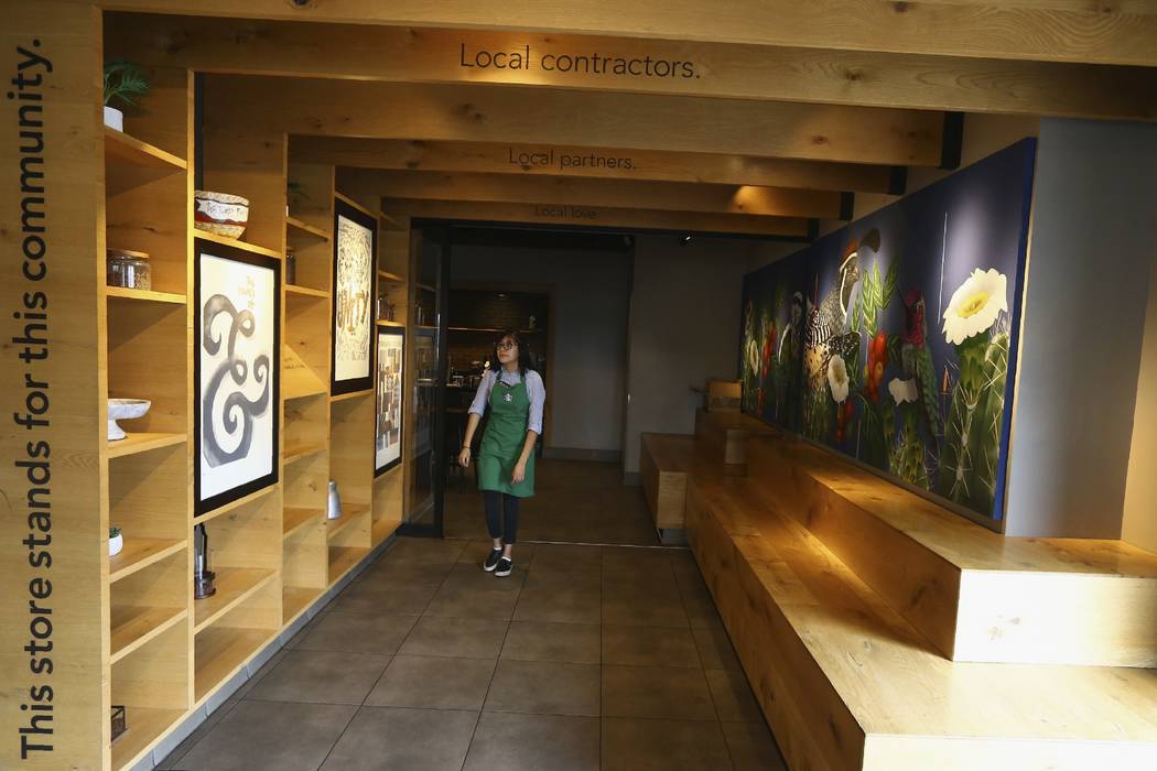 In this Wednesday, Jan. 15, 2020, photo, Belith Ariza, a barista trainer at Starbucks, walks ba ...