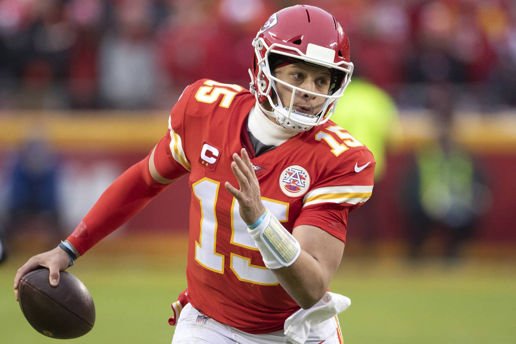 Kansas City Chiefs quarterback Patrick Mahomes scrambles for yardage during an NFL divisional p ...