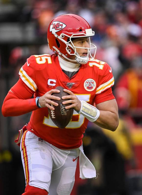 Kansas City Chiefs quarterback Patrick Mahomes (15) scrambles against the Houston Texans during ...