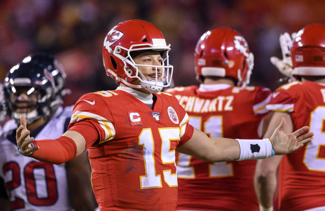 Kansas City Chiefs quarterback Patrick Mahomes (15) celebrates as time runs out in their win ov ...