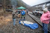 In this Tuesday, Jan. 14, 2020, photo, miners, who say they haven't been paid in nearly three w ...