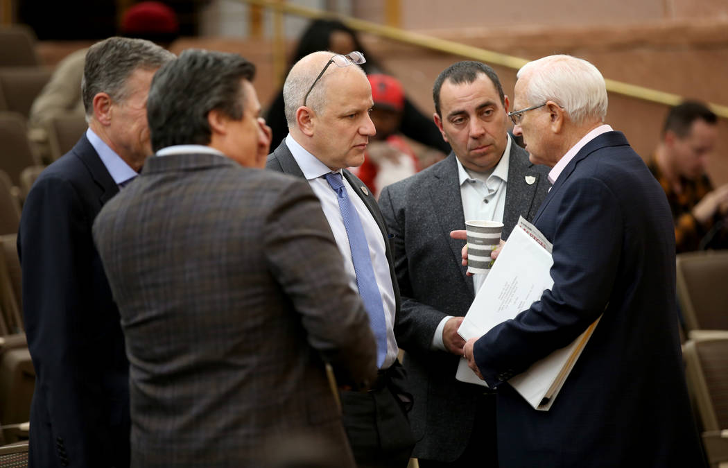 Raiders President Marc Badain, center, is flanked by, from left, Las Vegas Stadium Co. Chief Op ...