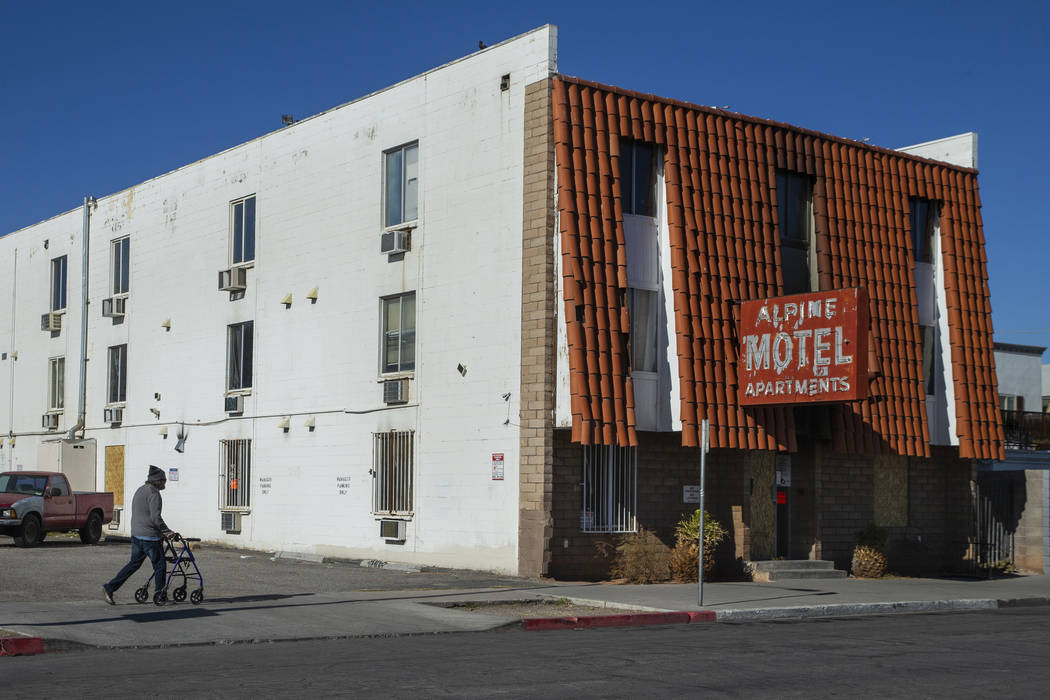 Earl Betts walks over to pay his respects on a daily trek to the Alpine Motel Apartments on Mon ...