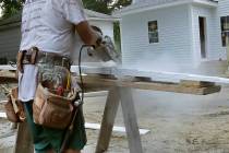 In a Oct. 2, 2019, file photo, a carpenter works on a construction site in North Andover, Mass. ...