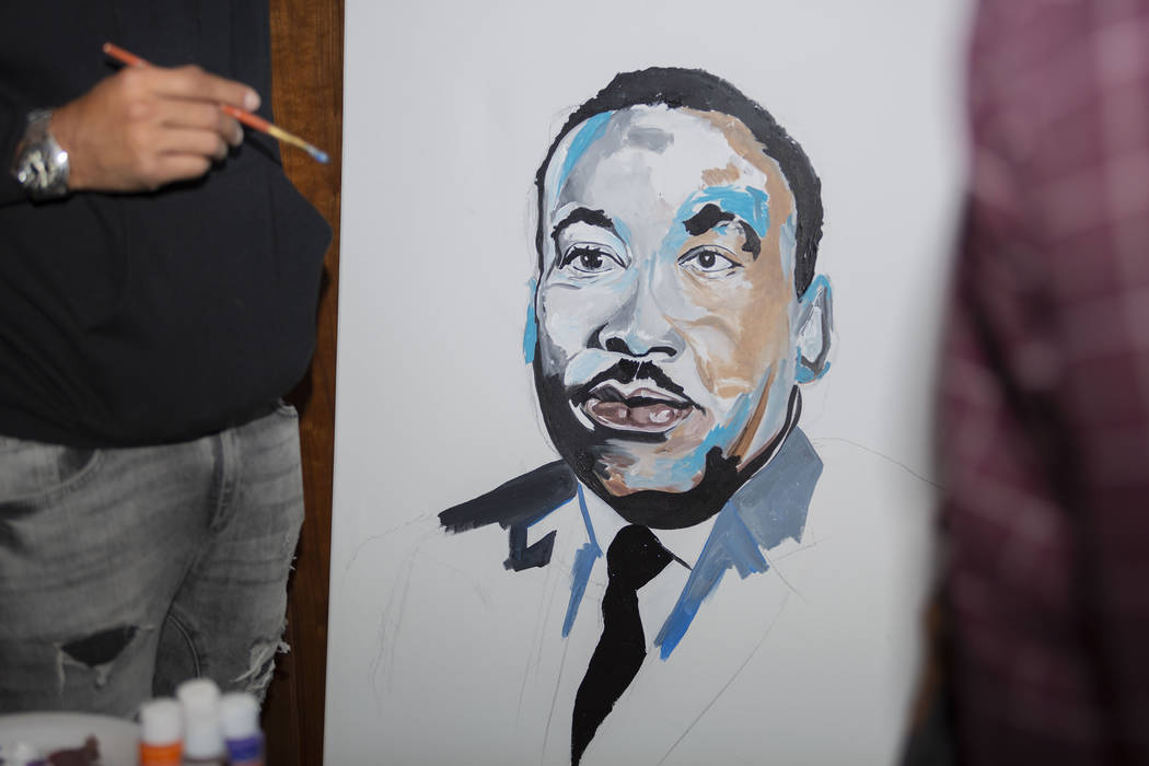Courtney "Yards" Haywood paints a portrait of Martin Luther King Jr. at Jardin Cannabis Dispens ...