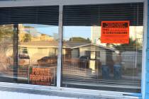 "Private Property" and "Unsafe to Occupy" signs are posted on the window of a house at 2017 S. ...