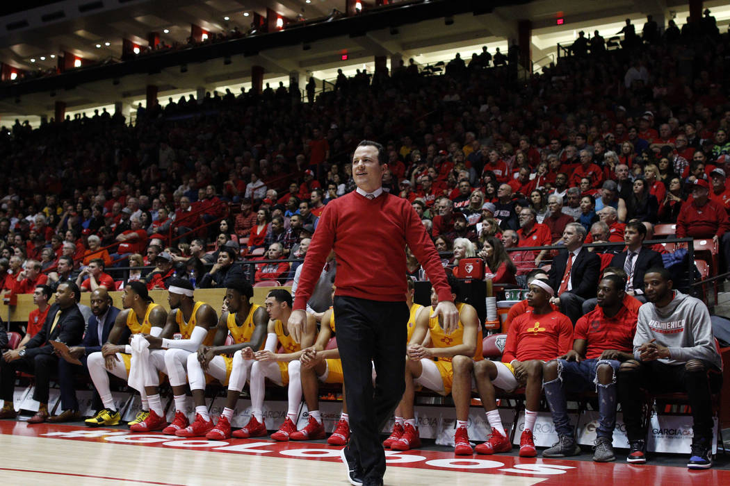 New Mexico head coach Paul Weir walks the sidelines during the first half of an NCAA college ba ...