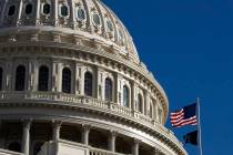 The U.S. flag flies over the U.S. Capitol in Washington, Sunday, Jan. 19, 2020. (AP Photo/Manue ...