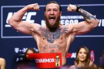 Conor McGregor poses during the ceremonial weigh-in event for UFC 246 in Las Vegas on Friday, J ...