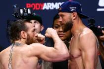 Conor McGregor, left, faces off against Donald "Cowboy" Cerrone ahead of their welter ...
