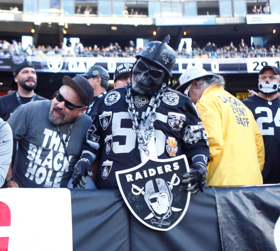 An Oakland Raiders in the Black Hole at Oakland-Alameda County Coliseum during the first half o ...