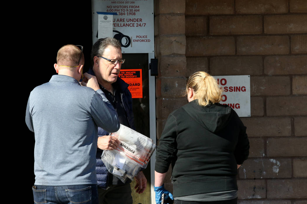 Investigators gather evidence at the Alpine Motel Apartments in downtown Las Vegas Jan. 14, 202 ...
