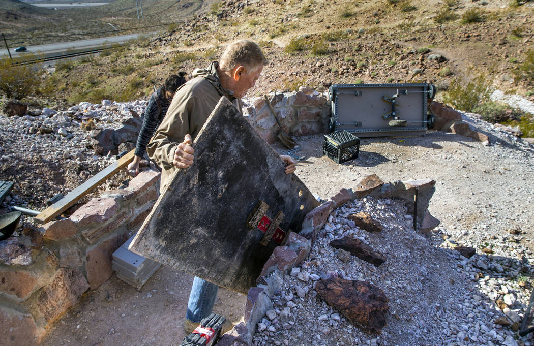 Richard Roman continues to clean out his cave after being evicted by Boulder City in the hills ...