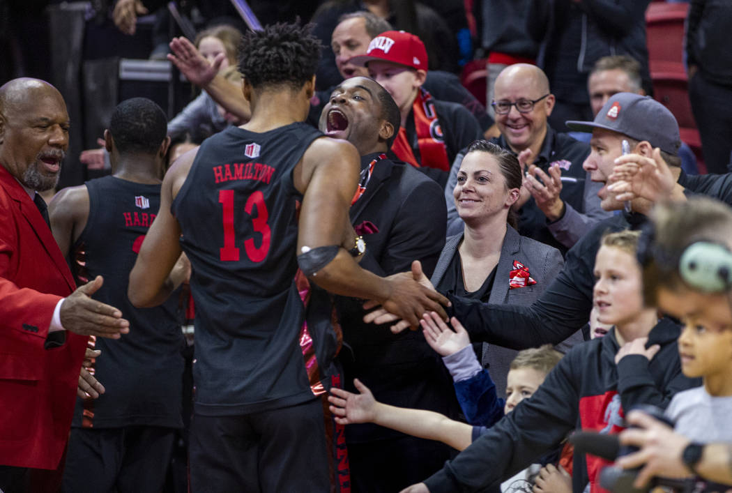 UNLV Rebels guard Bryce Hamilton (13) is celebrated by the fans while leaving the court followi ...