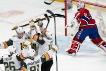 Montreal Canadiens goaltender Carey Price, right, breaks his stick after being scored against b ...