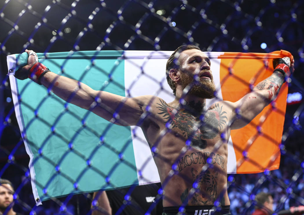 Conor McGregor celebrates after defeating Donald "Cowboy" Cerrone via technical knock ...