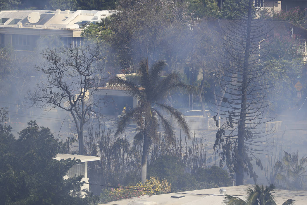 Several homes burn in near Diamond Head, Sunday, Jan. 19, 2020, in Honolulu, following a shooti ...