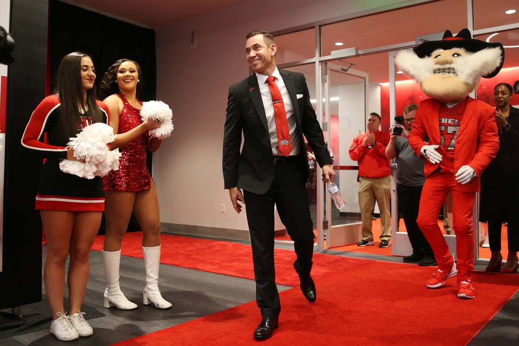 New UNLV football head coach Marcus Arroyo is introduced during a press conference at UNLV's Fe ...