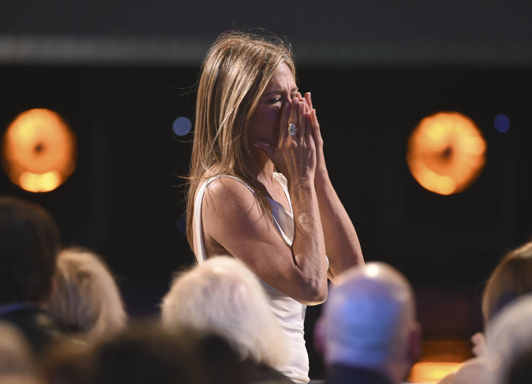 Jennifer Aniston reacts before going on stage to accept the award for outstanding performance b ...