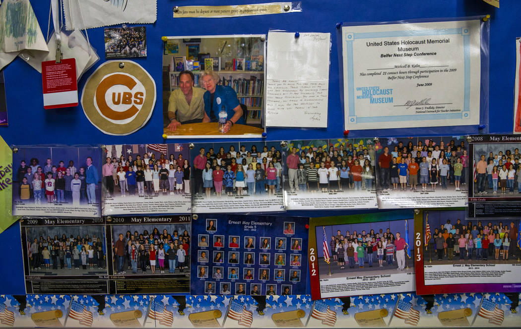 Class photos are some of the memorabilia hanging in the classroom of Leavitt Middle School Holo ...
