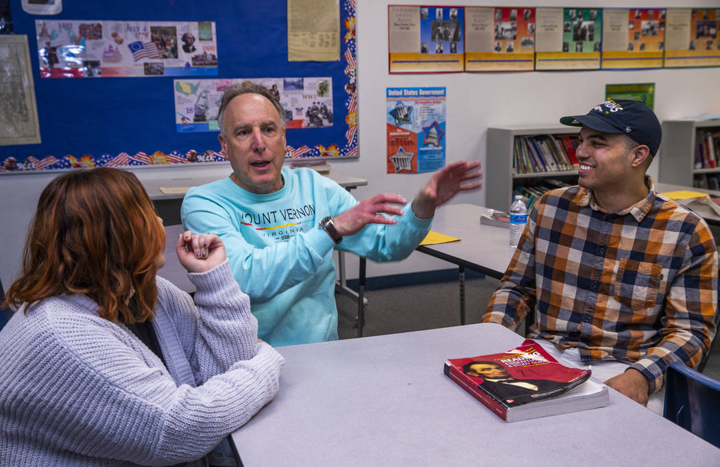 Leavitt Middle School Holocaust teacher Mitchell Kalin, center, talks about their class experie ...