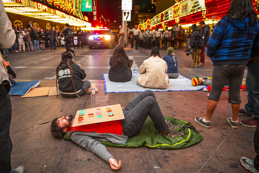 Local activists block Casino Center Blvd. through the Fremont Experience following a rally at t ...