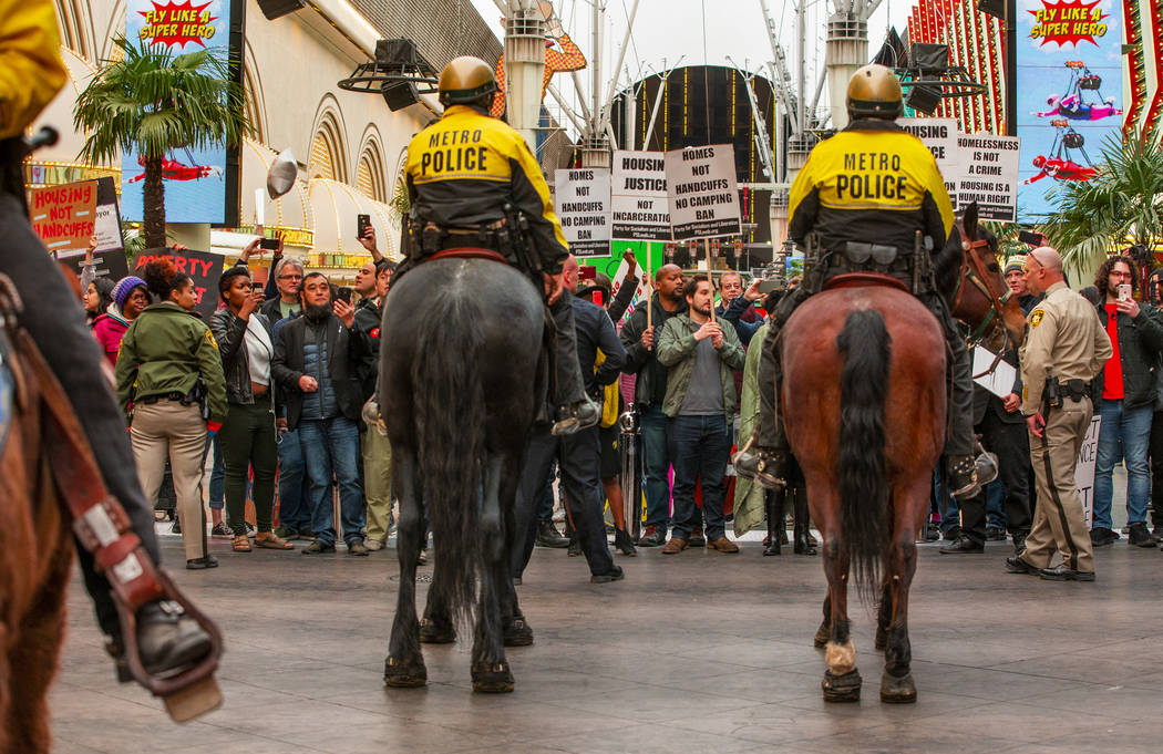 Las Vegas Metropolitan Police officers keep local activists back after blocking Casino Center B ...
